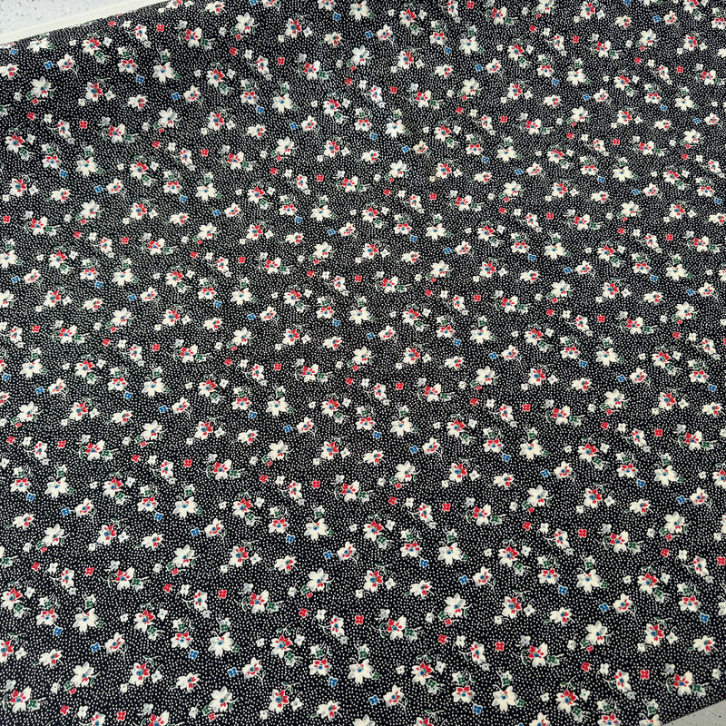 Black with Small White Dots and Floral Pattern Synthetic Knit - Yardage