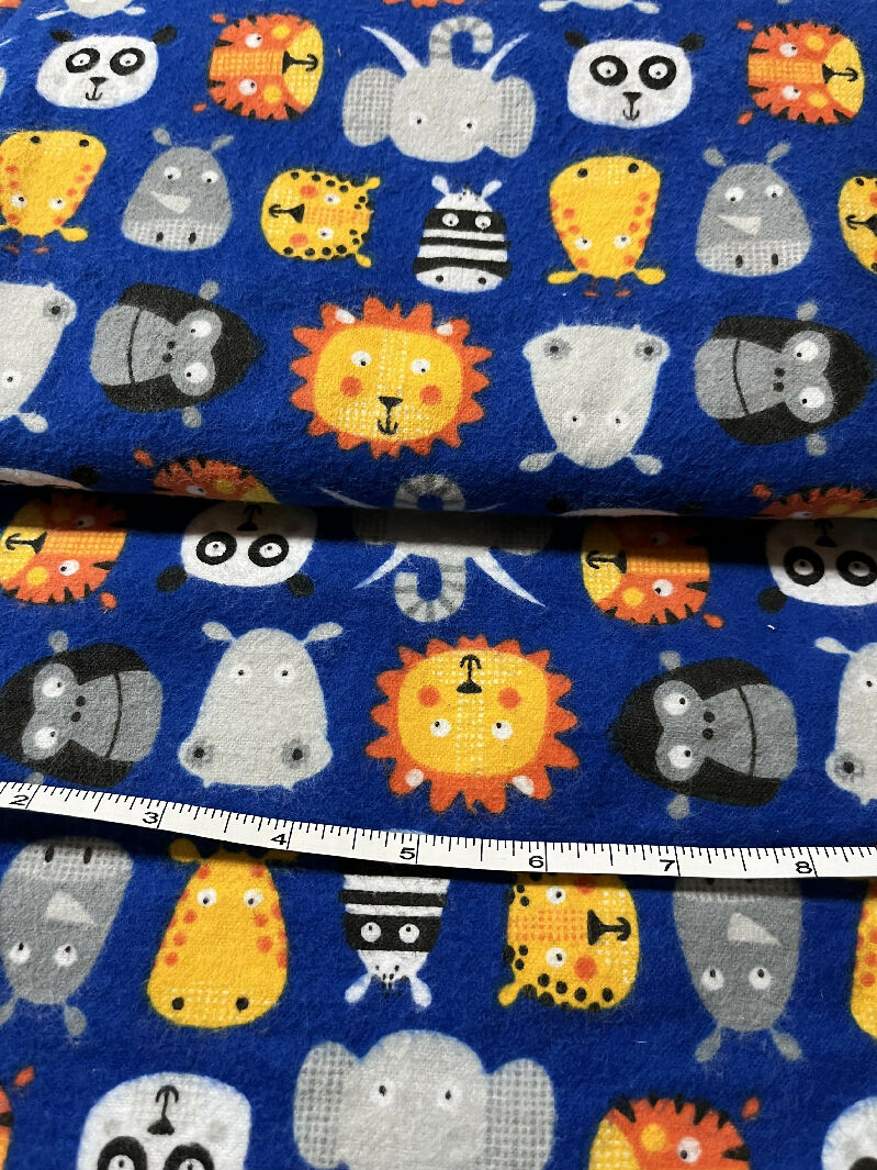 Cotton Flannel Fabric: Blue w/ Zoo Animal Faces