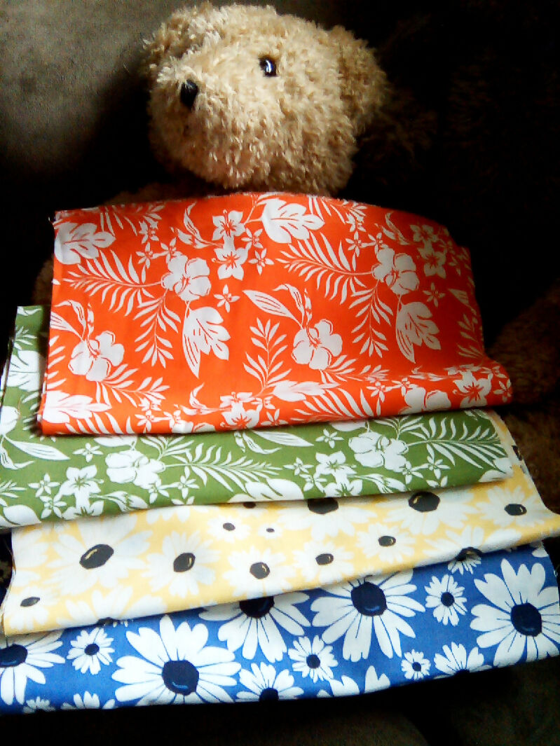 Cotton material, flower designs, blue, yellow, green, orange colors, 9" x 43"