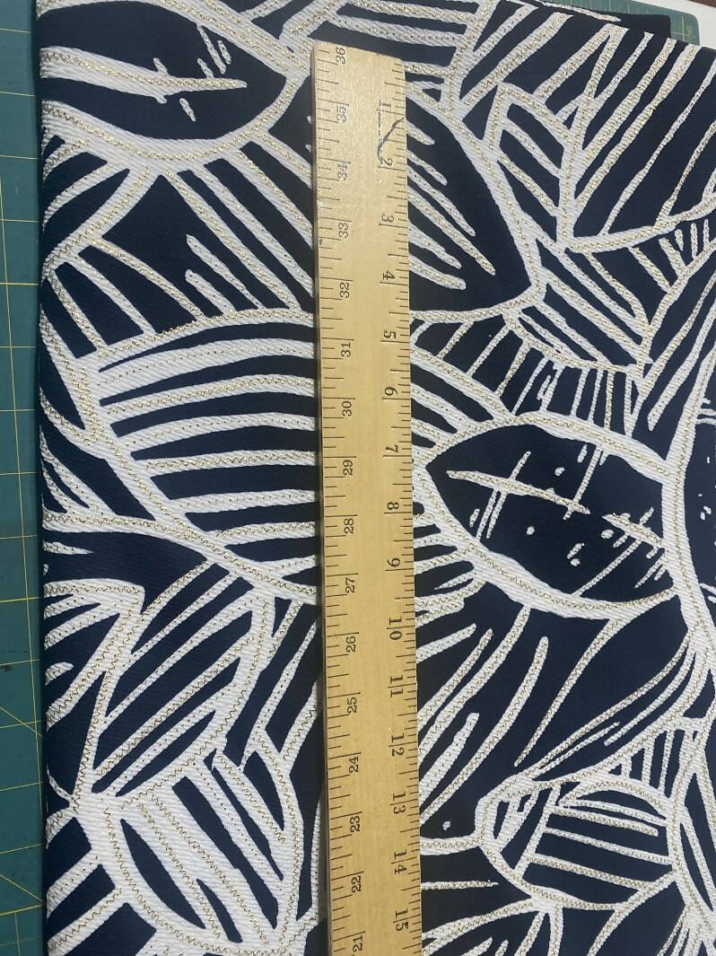 Black and white tropical leaf print knit with gold stitching 60" 2 1/2 yards
