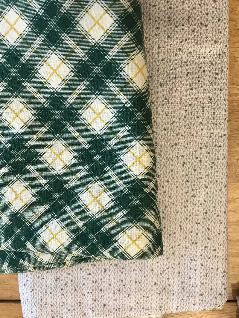 Green plaid and gray cable knit pattern fabric