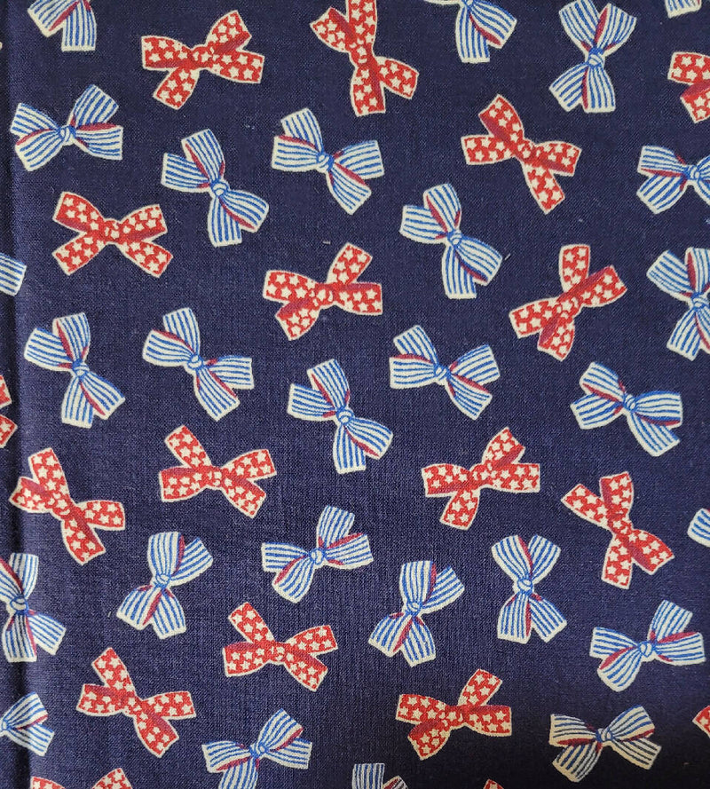 Quilting cotton bows on navy 1 1/2 yards
