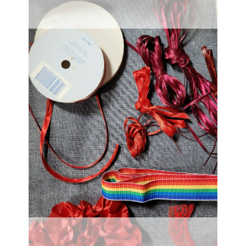 Bundle of red sewing trims and laces