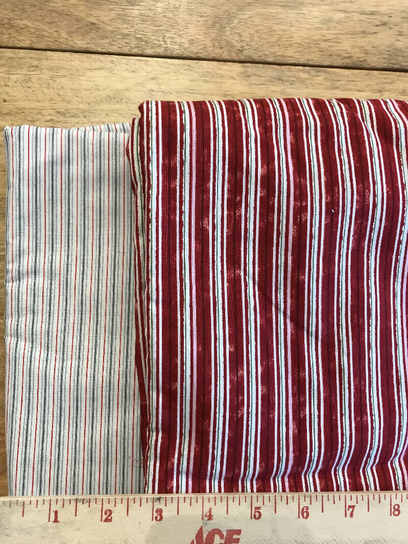 Striped fabrics: thin gray and red stripes; red stripes