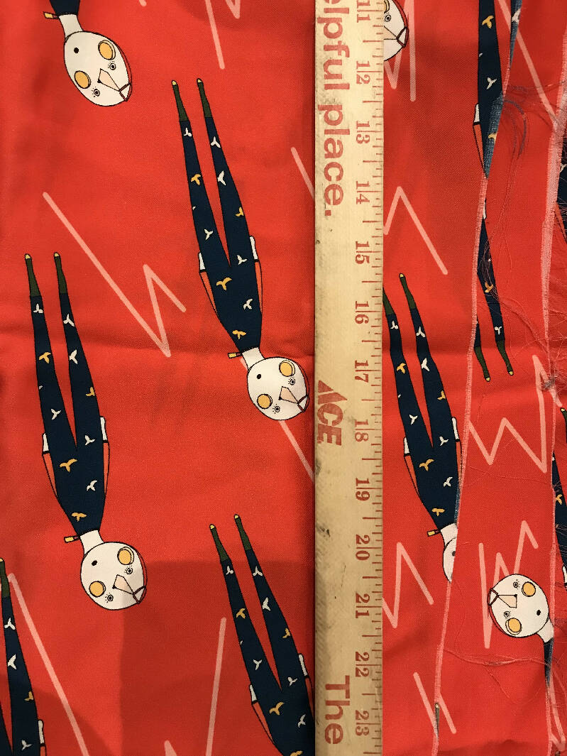 Silky fabric in red with navy flying man