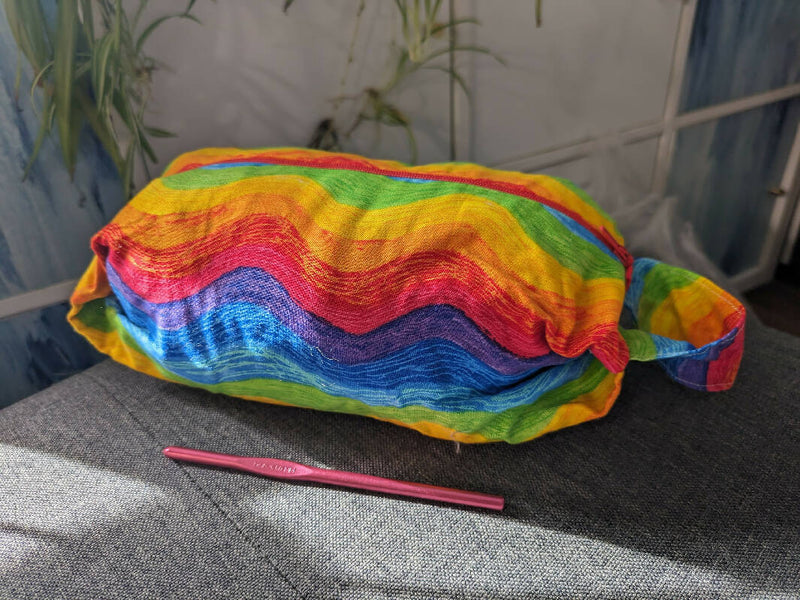 Hand made project bag in reverisible cotton, red and rainbow