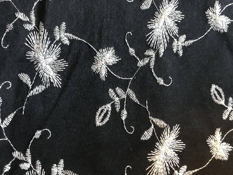 Lightweight embroidered knit fabric-black with cream floral design