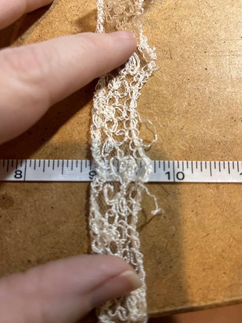 Approximately 13 yards of off-white lace