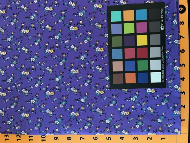 Lilac colored cotton print with white and yellow flowers