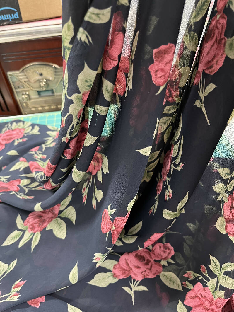 Polyester Chiffon Navy with burgundy roses 44” wide