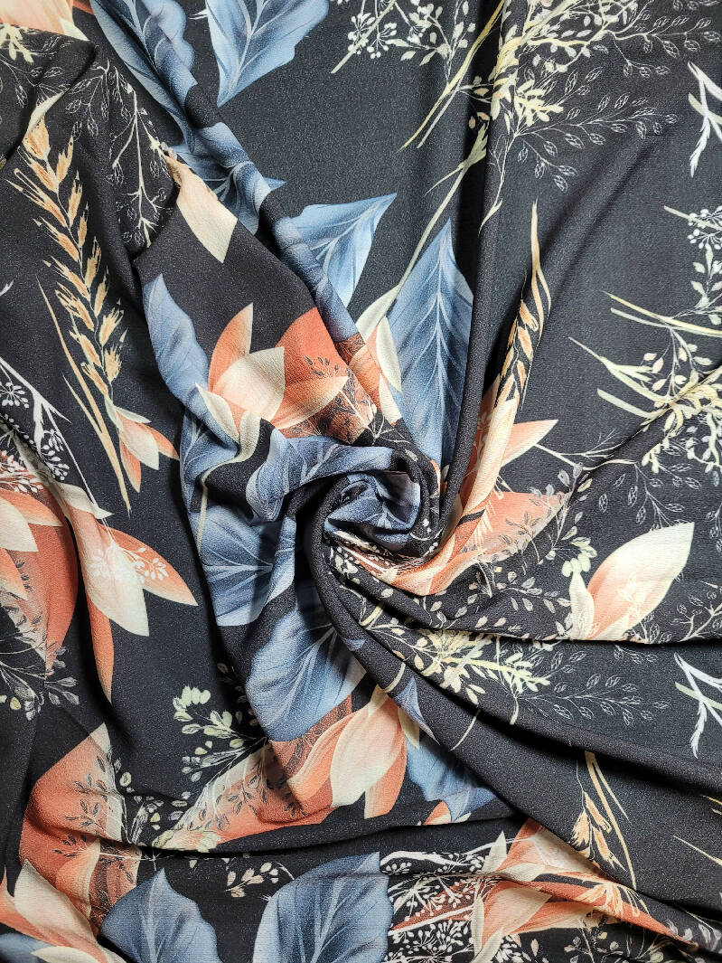 Black pebbled crepe floral with peach and lt blue 1 1/2 + yds