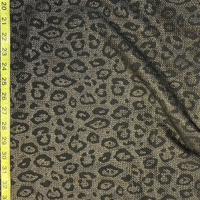 Leopard Spotted Black and Gold Liverpool Synthetic Knit - 2.75 Yds
